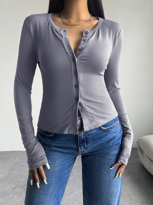 Top abotonado de color sólido, manga larga y estilo camiseta