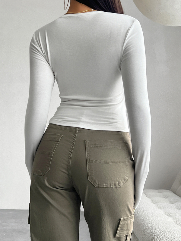Top abotonado de color sólido, manga larga y estilo camiseta